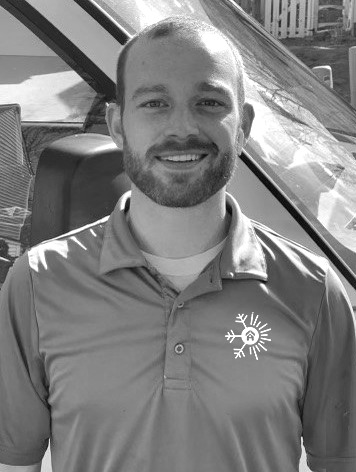 A.N.T. Comfort Solutions team member smiling in company uniform